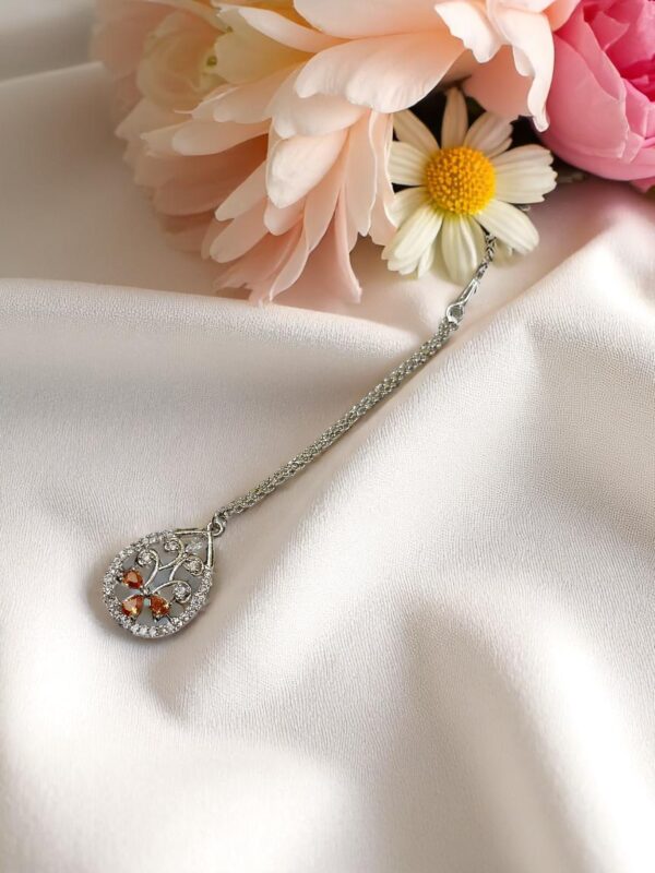 Elegant Orange Colored Ad Maang Tikka with Stone Detailing